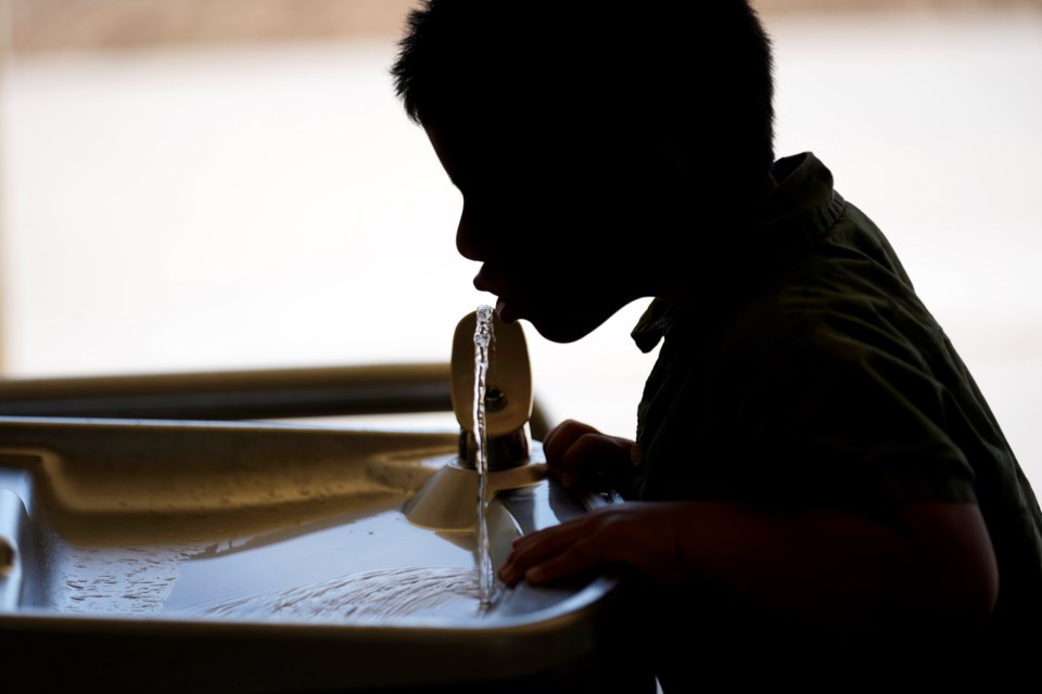 FILE - A student drinks from a water fountain at an elementary school in California, Sept. 20, 2023. (AP Photo/Marcio Jose Sanchez, File)