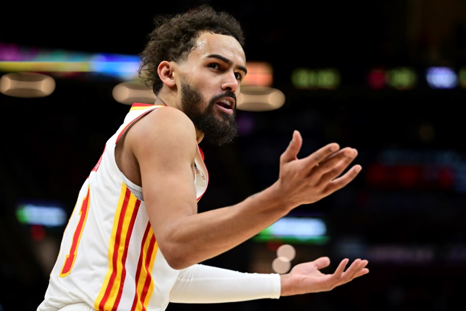 Atlanta Hawks guard Trae Young disputes a non-call with a referee in the second half of an NBA basketball game against the Cleveland Cavaliers, Thursday, Jan. 30, 2025, in Cleveland. (AP Photo/David Dermer)