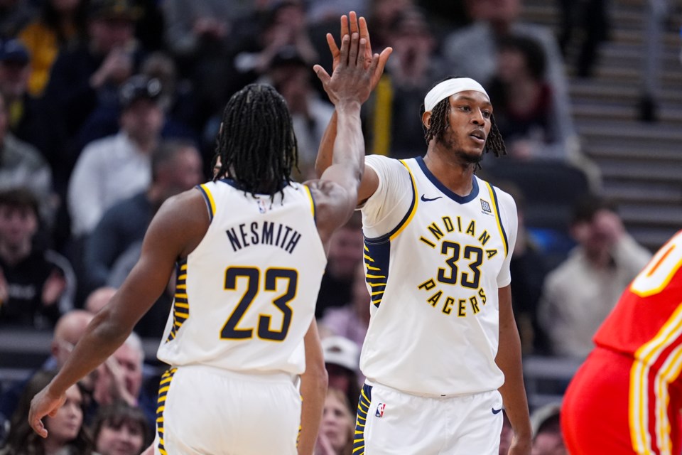 Indiana Pacers center Myles Turner (33) celebrates a basket and being fouled against the Atlanta Hawks during the first half of an NBA basketball game in Indianapolis, Saturday, Feb. 1, 2025. (AP Photo/Michael Conroy)