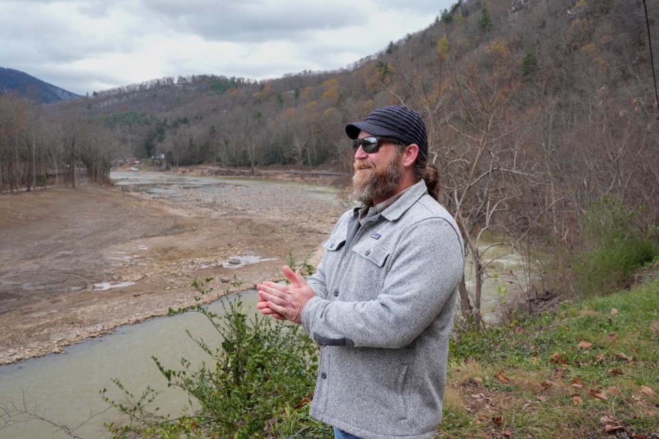 Patrick Mannion, owner of Osprey Whitewater, looks over the Nolichuky River, Friday, Nov. 22, 2024, in Erwin, Tenn. (AP Photo/George Walker IV)