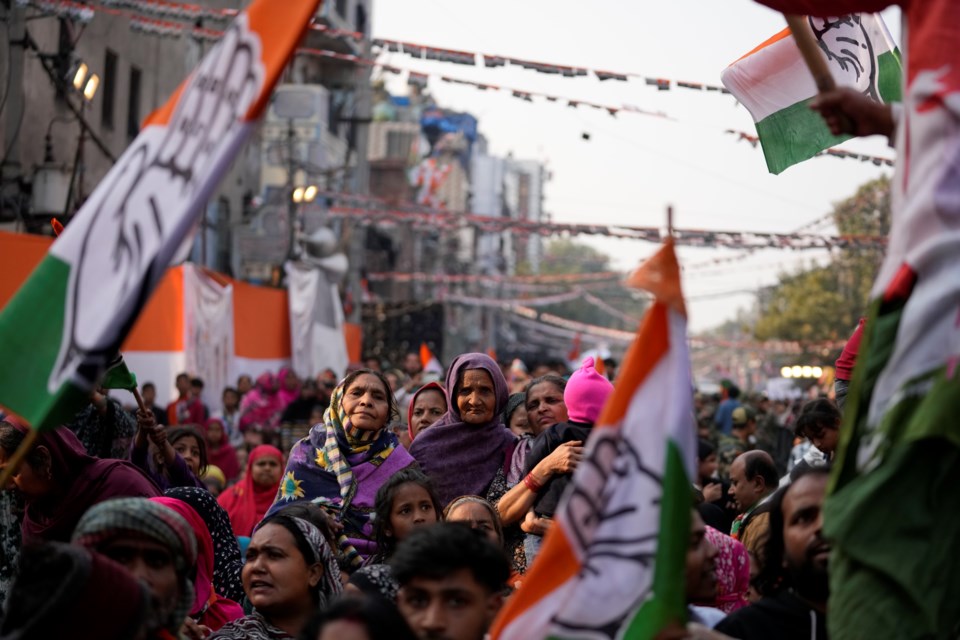 Supporters of Congress party listen to their leader Rahul Gandhi during Delhi Assembly election campaign rally in Delhi, India, Thursday, Jan. 30, 2025. (AP Photo/Channi Anand)