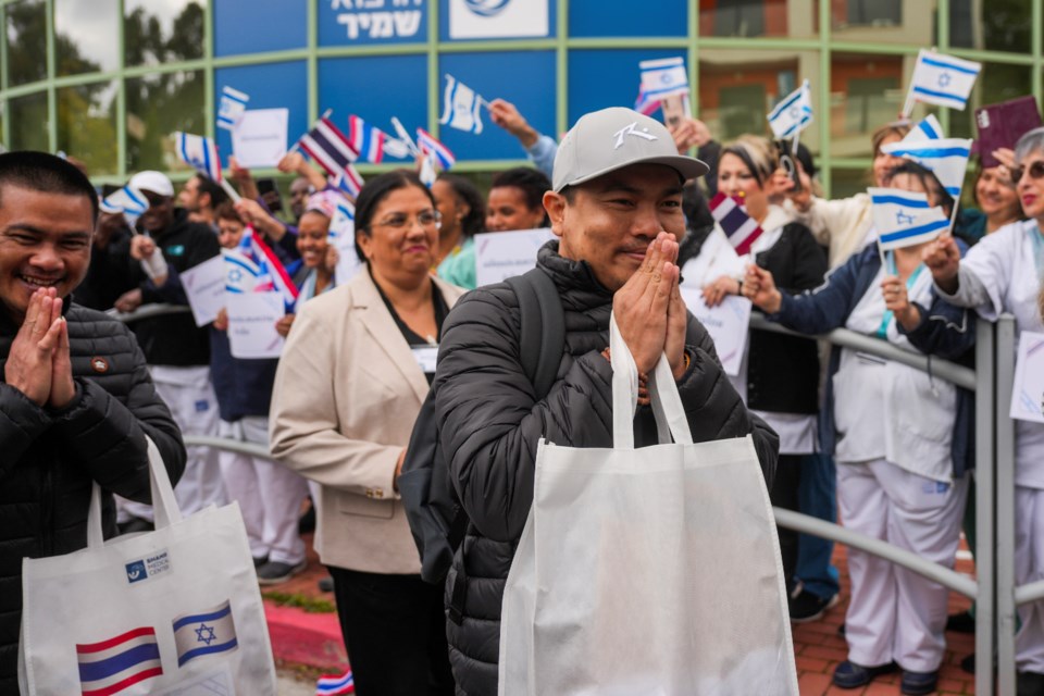 Thai citizens, who were released from Hamas captivity in Gaza as part of the Israel-Hamas ceasefire deal, leave Shamir Medical Center (Assaf Harofeh) in Be'er Ya'akov, Israel, Saturday, Feb. 8, 2025. (AP Photo/Ohad Zwigenberg)