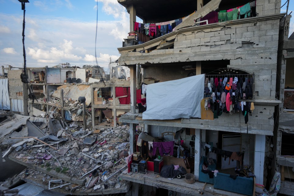 Laundry hangs on a destroyed building caused by the Israeli air and ground offensive in Jabaliya, Gaza Strip, Wednesday, Feb. 5, 2025. (AP Photo/Abdel Kareem Hana)