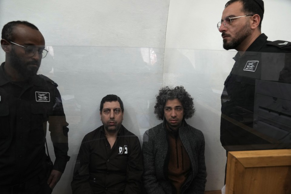 Booksellers Ahmad, left, and Mahmoud Muna appear in court after their arrest during an Israeli police raid of their long-established Palestinian-owned Educational Bookshop in east Jerusalem, Monday, Feb. 10, 2025. (AP Photo/Mahmoud Illean)