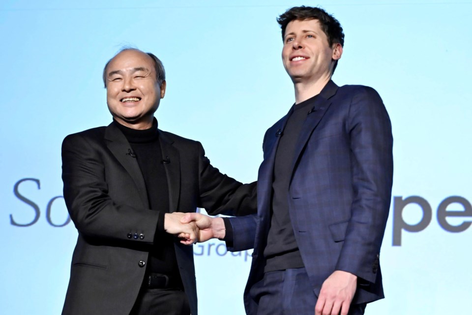 SoftBank Chief Masayoshi Son, left, and OpenAI Chief Sam Altman shake hands during an event in Tokyo, in Tokyo, Monday, Feb. 3, 2025. (Kyodo News via AP)