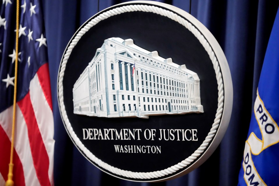 FILE - The logo for the Justice Department is seen before a news conference at the Department of Justice, Aug. 23, 2024, in Washington. (AP Photo/Mark Schiefelbein, File)