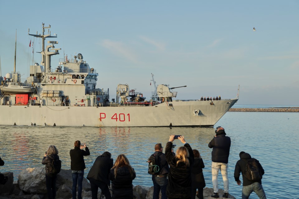 An Italian navy ship approaches the port, as Italy sends 49 more migrants to Albania for processing following earlier court rejections, in Shengjin, northwestern Albania, Tuesday, Jan. 28, 2025. (AP Photo/Vlasov Sulaj)