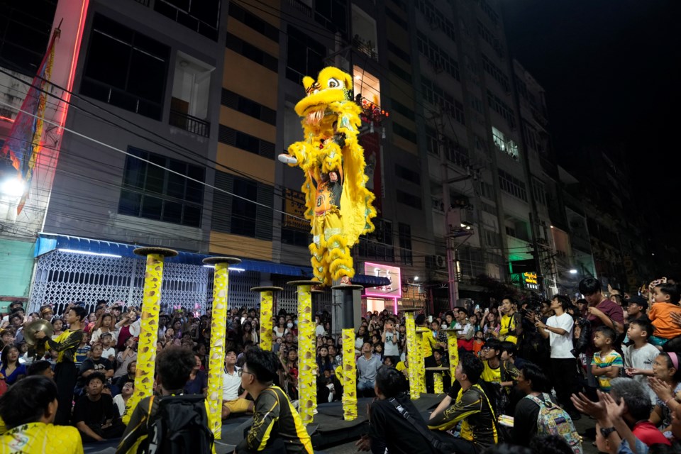 Chinese artists leap from pedestals as they perform a traditional lion dance marking the Lunar New Year of the Snake in the Chinatown area of Yangon, Myanmar, Sunday, Jan. 26, 2025. (AP Photo/Thein Zaw)