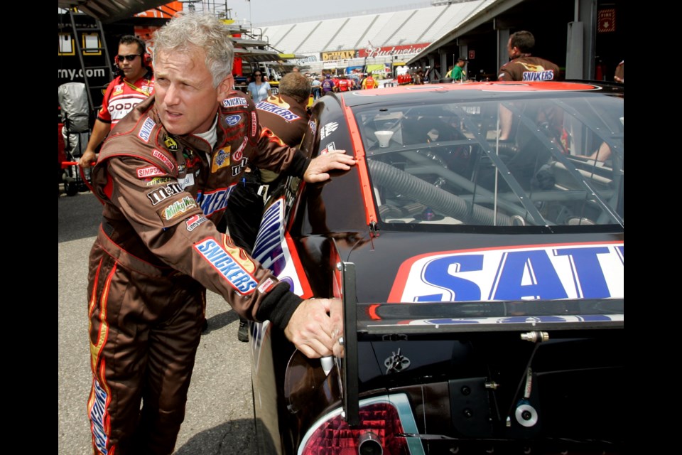 FILE - NASCAR driver Ricky Rudd pushes his car with members of his crew into the garage during practice for the Autism Speaks 400 auto race at Dover Speedway in Dover, Del., Friday, June 1, 2007. (AP Photo/Carolyn Kaster, File)