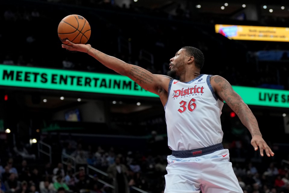 Washington Wizards guard Marcus Smart goes up to shoot against the Brooklyn Nets during the first half of an NBA basketball game Monday, Feb. 24, 2025, in Washington. (AP Photo/Jess Rapfogel)