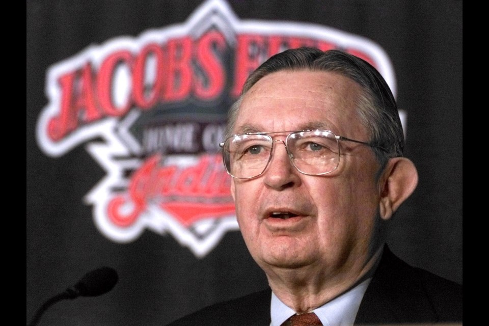 FILE - Attorney Larry Dolan answers questions at a news conference in Cleveland after Cleveland Indians owner Richard Jacobs announced an agreement to sell the team to Dolan, Nov. 4, 1999. (AP Photo/Mark Duncan, File)