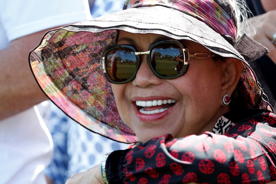 FILE - Kultida Woods, Tiger Woods' mother, watches as her son plays on the third hole during the third round of the Honda Classic golf tournament, Saturday, Feb. 24, 2018 in Palm Beach Gardens, Fla. (AP Photo/Wilfredo Lee, File)