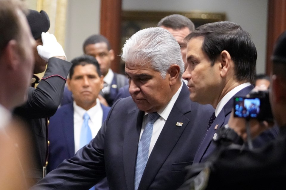 Panama's President Jose Mulino, left, and U.S. Secretary of State Marco Rubio arrive for a meeting at the presidential palace in Panama City, Sunday, Feb. 2, 2025. (AP Photo/Mark Schiefelbein, Pool)