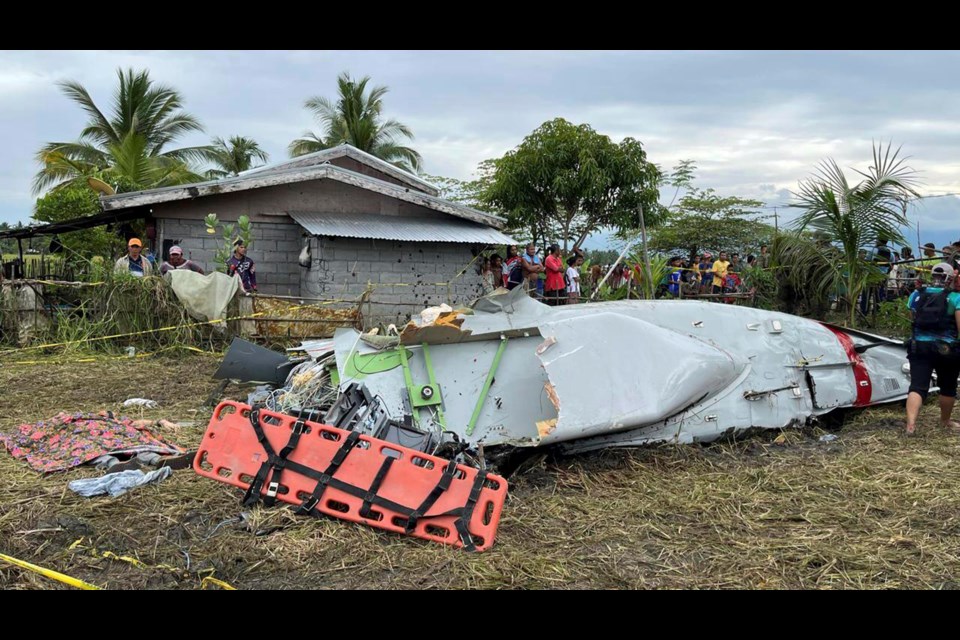 Wreckage of airplane in a rice field in Maguindanao del Sur province, Philippines, after officials say a U.S. military-contracted plane has crashed in a rice field in the southern Philippines, killing all four people on board, on Thursday Feb. 6, 2025. (Sam Mala/UGC via AP)