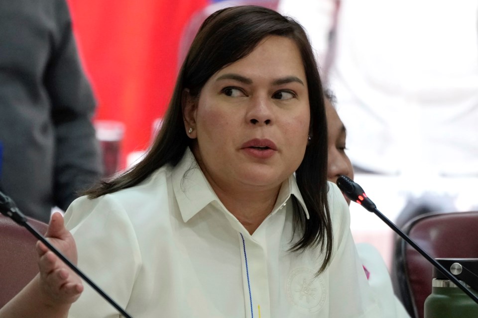 FILE -Philippine Vice President Sara Duterte gestures as she attends a hearing at the House of Representative in Quezon City, Philippines, Nov. 25, 2024.(AP Photo/Aaron Favila), File)