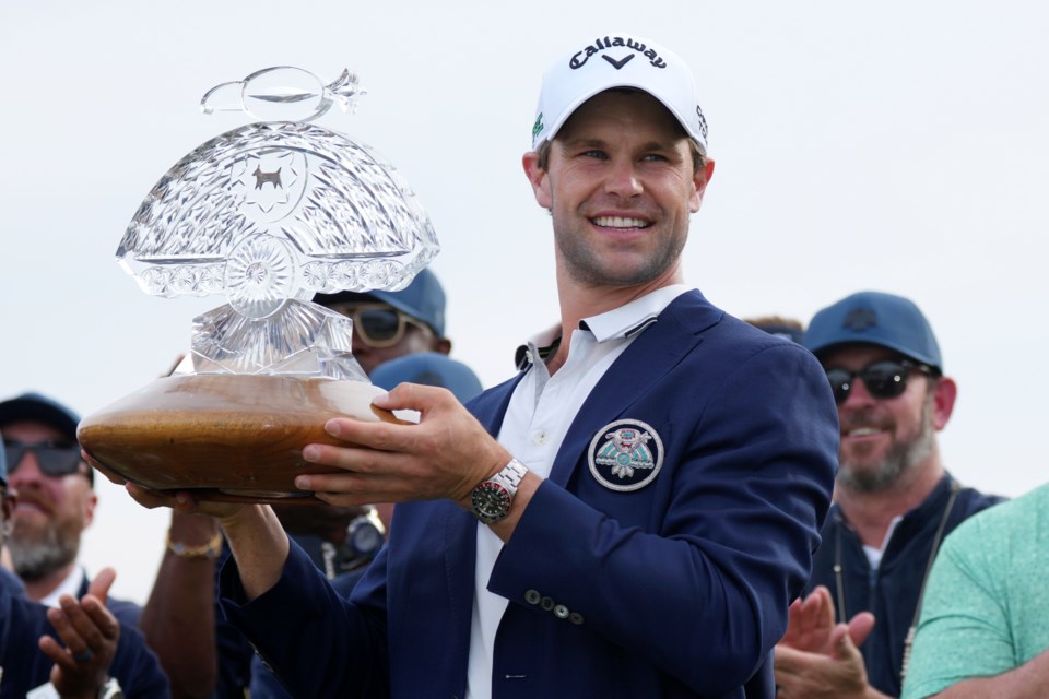 Thomas Detry, of Belgium, celebrates after winning the Phoenix Open golf tournament at TPC Scottsdale, Sunday, Feb. 9, 2025, in Scottsdale, Ariz. (AP Photo/Ross D. Franklin)