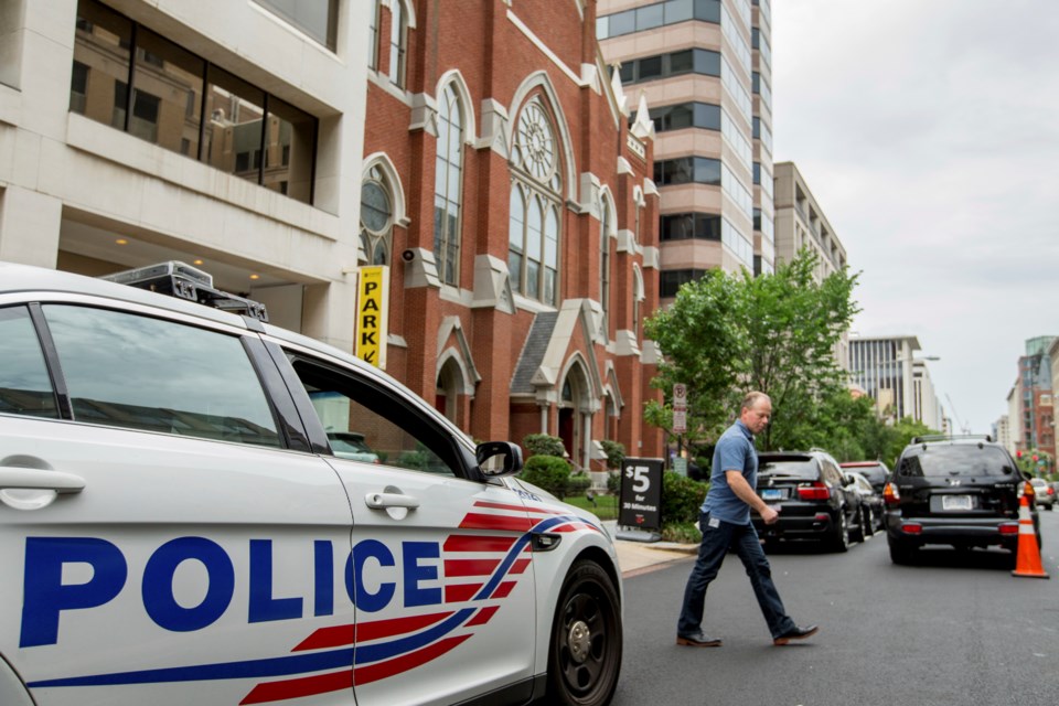 FILE - A Washington police vehicle sits outside the Metropolitan African Methodist Episcopal Church in Washington, June 19, 2015. (AP Photo/Andrew Harnik)