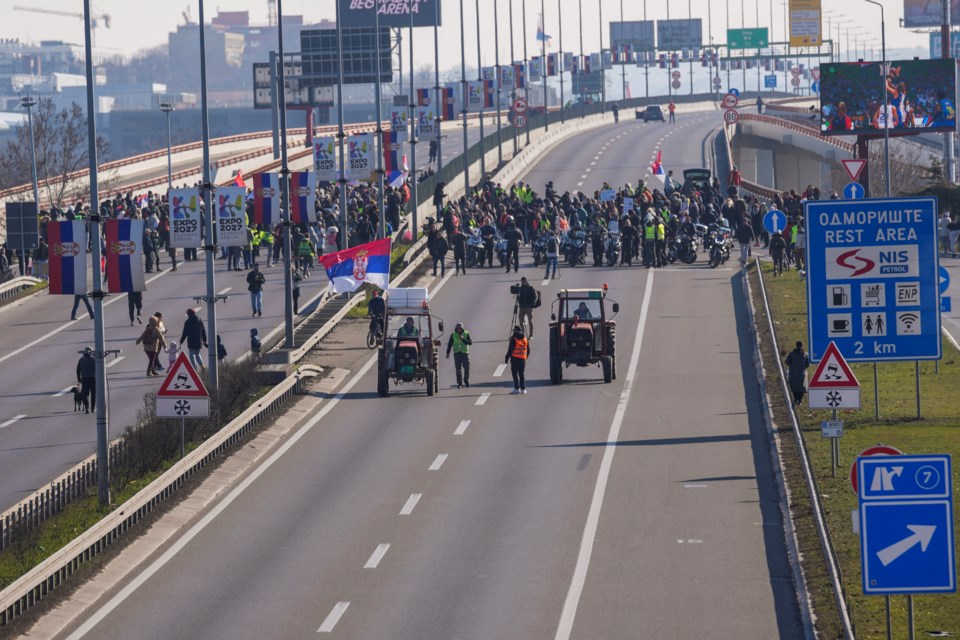 People participate in a 7-hour long blockade of a highway in Belgrade, Serbia, Sunday, Feb. 9, 2025, to protest the Nov. 1. collapse of a concrete canopy at the central train station in Novi Sad, that killed 15 people. (AP Photo/Darko Vojinovic)