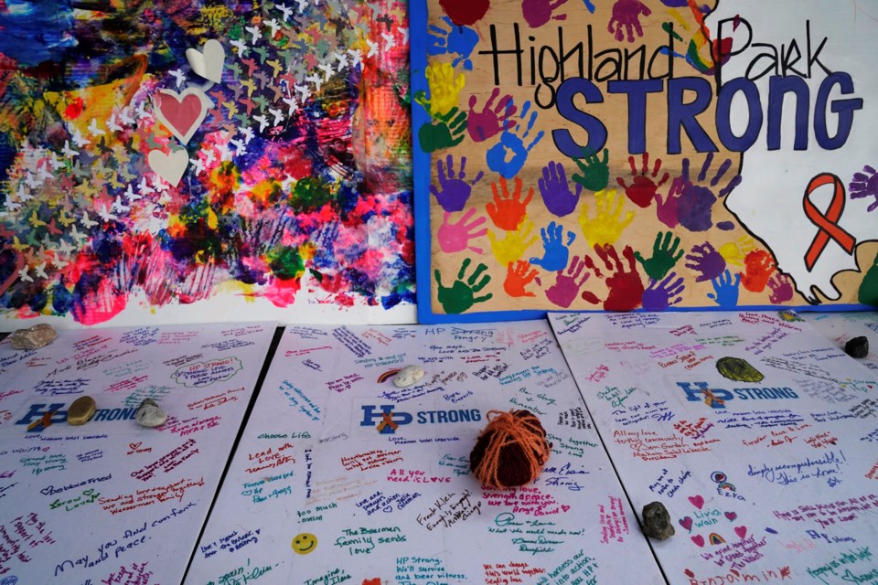 FILE - Hand written, painted signs and rocks dedicated to the seven people killed and others injured in the Fourth of July mass shooting are seen at a memorial site, Thursday, July 21, 2022, in Highland Park, Ill. (AP Photo/Nam Y. Huh, File)