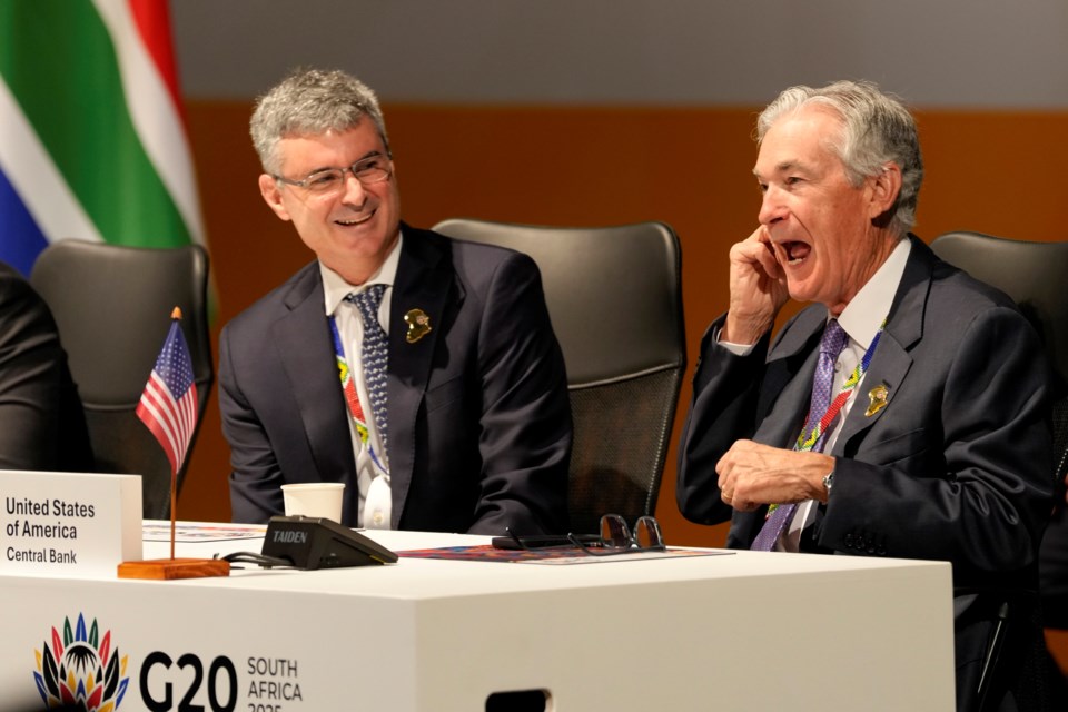 U.S. Federal Reserve Chair Jerome Powell, right, chats with a colleague at the G20 Finance Ministers and Central Bank Governors meeting in Cape Town, South Africa, Wednesday, Feb. 26, 2025. (AP Photo/Nardus Engelbrecht)