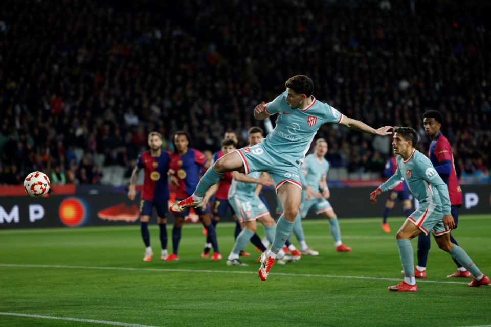 Atletico Madrid's Julian Alvarez scores during a Spanish Copa del Rey, or King's Cup, the semi-final soccer match between Barcelona and Atletico Madrid in Barcelona, Spain, Tuesday, Feb. 25, 2025. AP Photo/Joan Monfort)