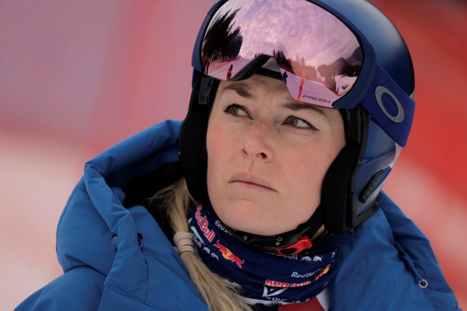 FILE - United States' Lindsey Vonn looks on ahead of an alpine ski, women's World Cup downhill training, in Garmisch-Partenkirchen, Germany, Friday, Jan. 24, 2025. (AP Photo/Giovanni Maria Pizzato, File)