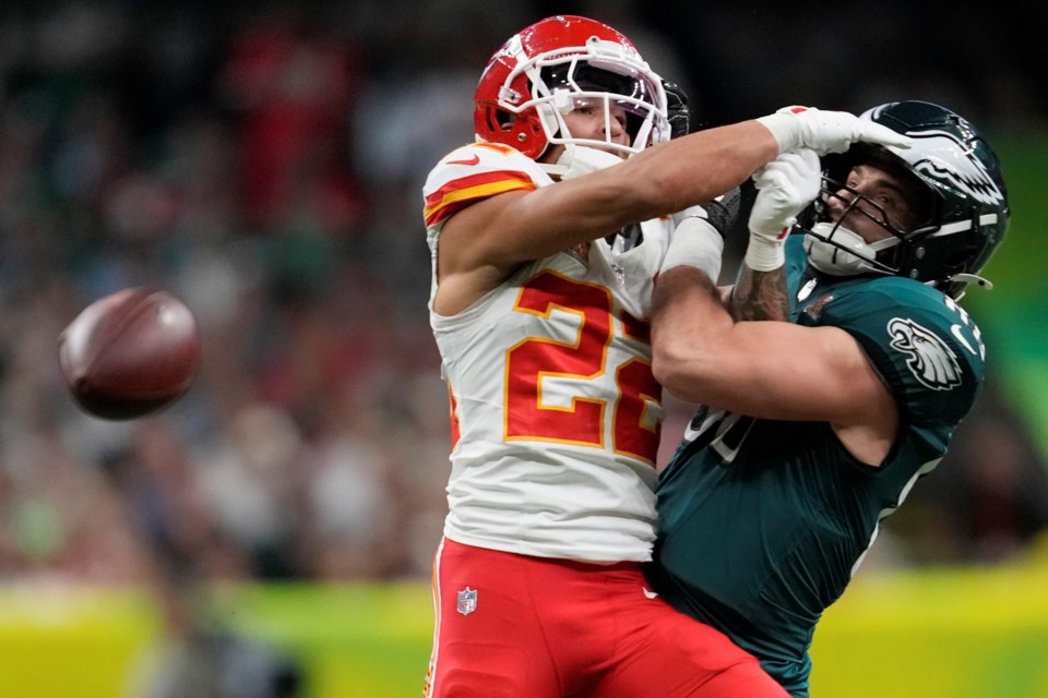 Kansas City Chiefs cornerback Trent McDuffie (22) breaks up a pass intended for Philadelphia Eagles tight end Dallas Goedert during the first half of the NFL Super Bowl 59 football game, Sunday, Feb. 9, 2025, in New Orleans. (AP Photo/Ashley Landis)