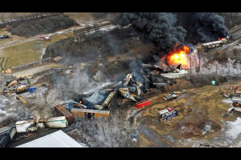 FILE - In this photo taken with a drone, portions of a Norfolk Southern freight train that derailed the previous night in East Palestine, Ohio, remain on fire at mid-day, Feb. 4, 2023. (AP Photo/Gene J. Puskar, File)