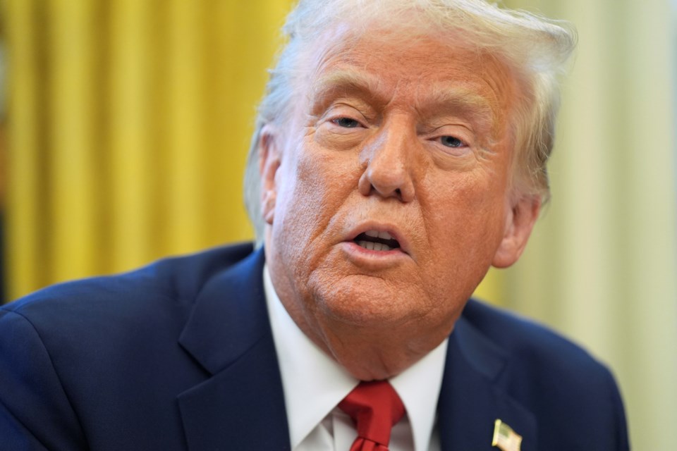 President Donald Trump speaks as he signs executive orders in the Oval Office of the White House, Monday, Feb. 3, 2025, in Washington. (AP Photo/Evan Vucci)