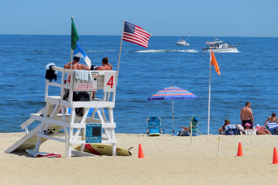 FILE - A boat passes by July 2, 2024, off Sea Girt, N.J., where a power cable from the Atlantic Shores offshore wind farm project is projected to come ashore. (AP Photo/Wayne Parry, File)