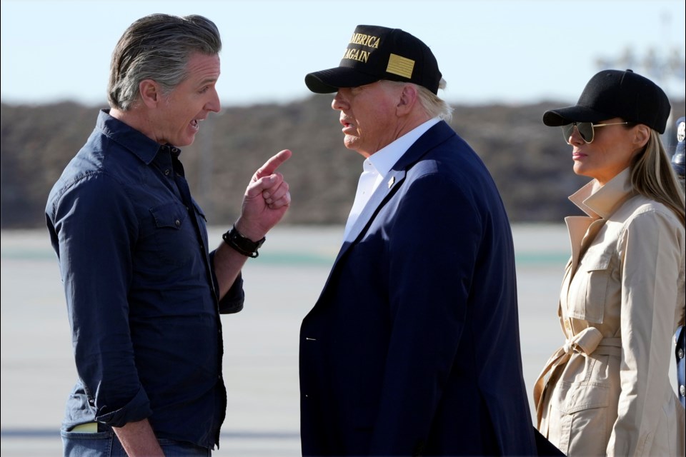 FILE - President Donald Trump and first lady Melania Trump listen to California Gov. Gavin Newsom after arriving on Air Force One at Los Angeles International Airport in Los Angeles, Jan. 24, 2025. (AP Photo/Mark Schiefelbein, File)