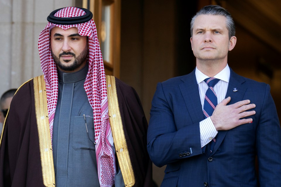 Secretary of Defense Pete Hegseth, right, participates in a welcome ceremony with Saudi Arabia's Defense Minister Prince Khalid bin Salman, Monday, Feb. 24, 2025, at the Pentagon in Washington. (AP Photo/Jacquelyn Martin)