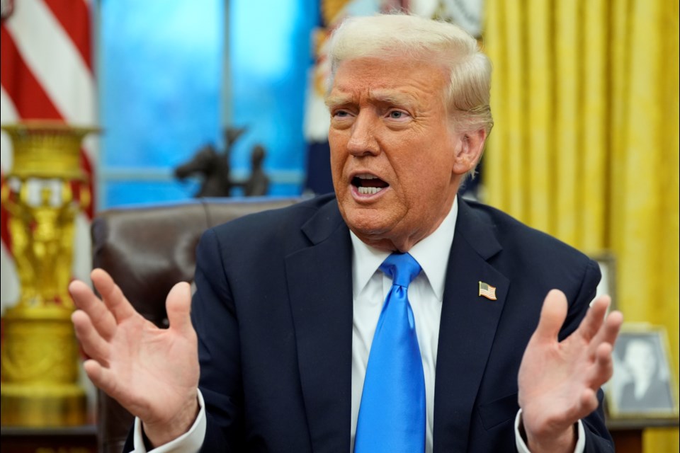 FILE - President Donald Trump speaks with reporters in the Oval Office at the White House, Tuesday, Feb. 11, 2025, in Washington. (AP Photo/Alex Brandon, File)