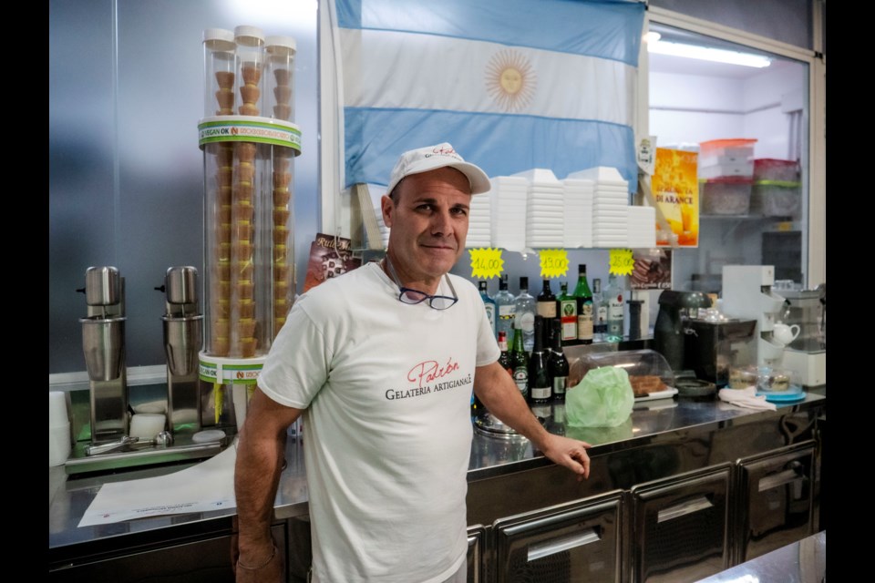 Sebastian Padrón, from La Plata, Argentina, poses in his ice cream in Rome, Tuesday, Feb. 25, 2025. (AP Photo/Paolo Santalucia)