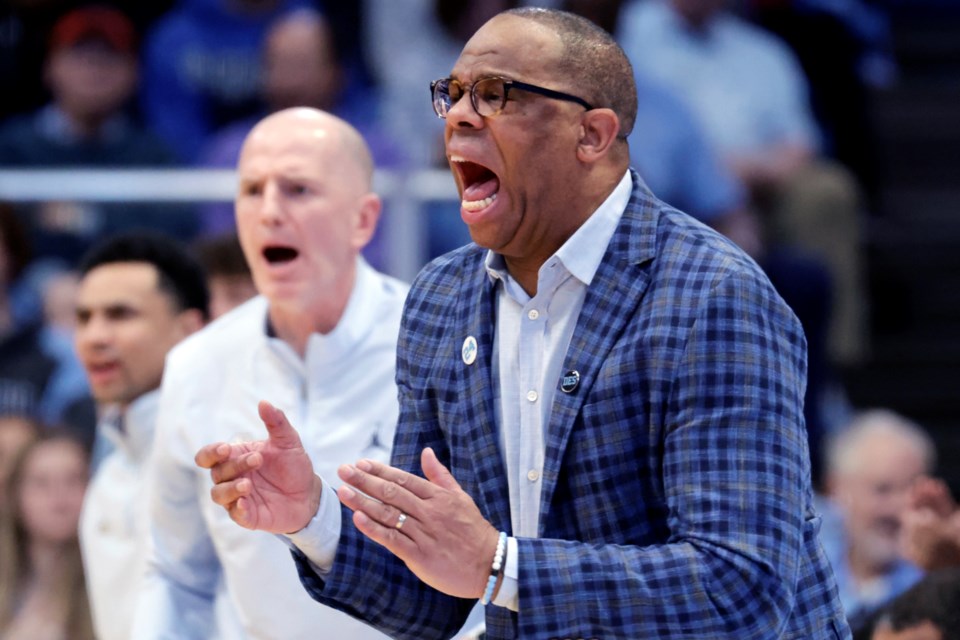 North Carolina head coach Hubert Davis directs the team against Virginia during the second half of an NCAA college basketball game Saturday, Feb. 22, 2025, in Chapel Hill, N.C. (AP Photo/Chris Seward)