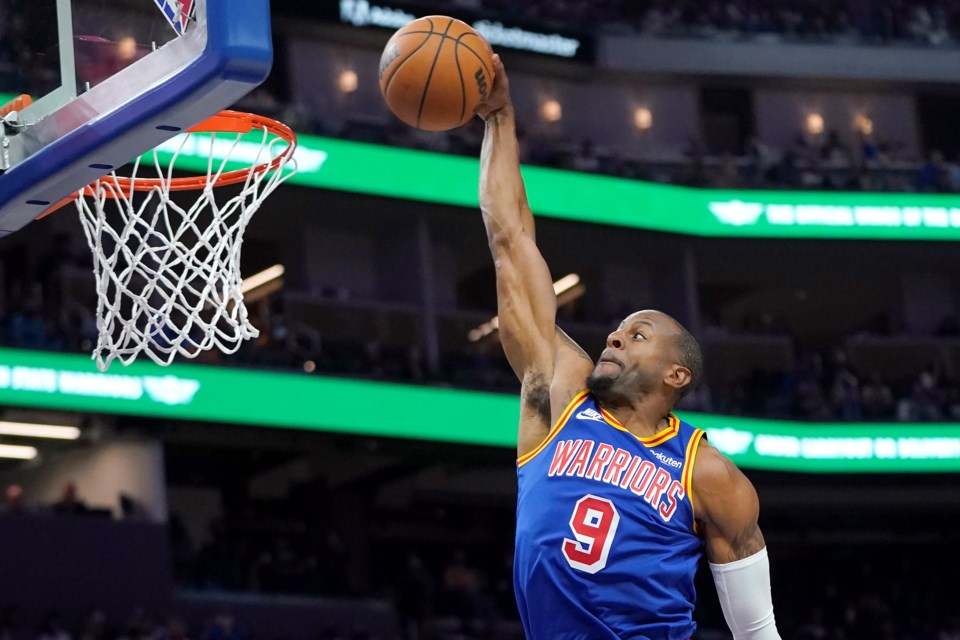 FILE - Golden State Warriors forward Andre Iguodala (9) dunks against the Chicago Bulls during the second half of an NBA basketball game in San Francisco, Friday, Nov. 12, 2021. (AP Photo/Jeff Chiu, File)