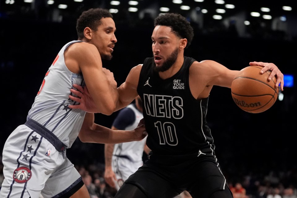 Washington Wizards' Malcolm Brogdon, left, defends Brooklyn Nets' Ben Simmons during the first half of an NBA basketball game Wednesday, Feb. 5, 2025, in New York. (AP Photo/Frank Franklin II)