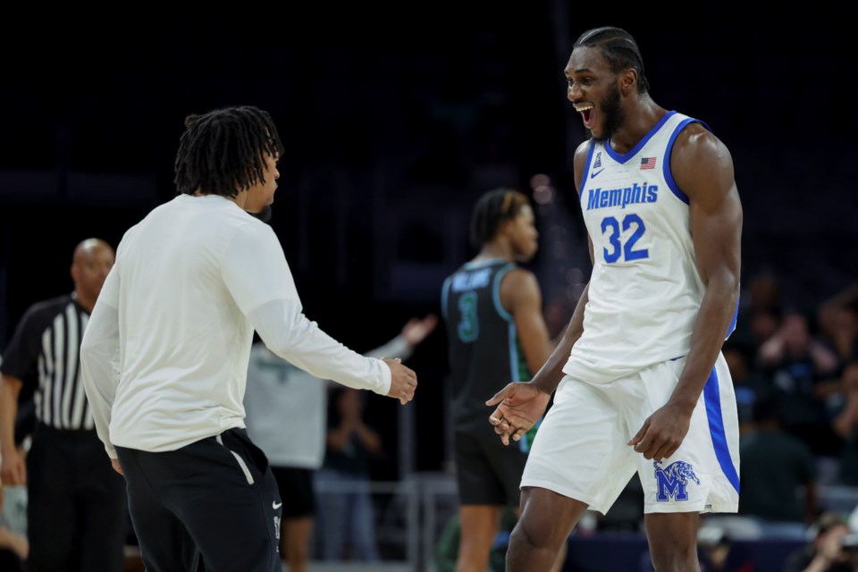 Memphis center Moussa Cisse (32) celebrates during the second half of an NCAA college basketball game against Tulane in the semifinals of the American Athletic Conference tournament, Saturday, March 15, 2025, in Fort Worth, Texas. (AP Photo/Gareth Patterson)