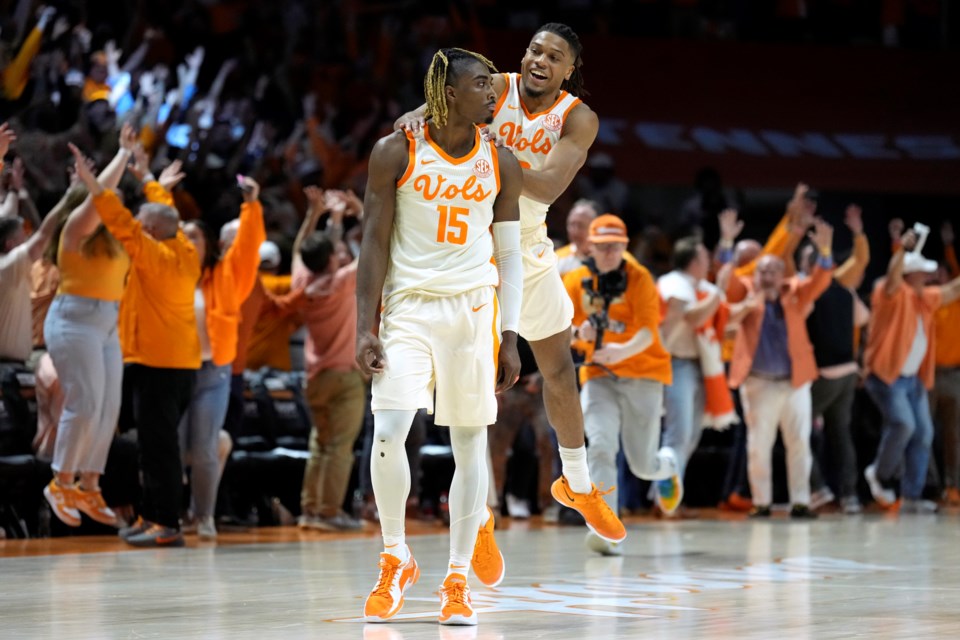 Tennessee guard Jahmai Mashack (15) is congratulated by Chaz Lanier after Mashack scored the winning three-point basket as time expired in the second half to give Tennessee a 79-76 win against Alabama in an NCAA college basketball game Saturday, March 1, 2025, in Knoxville, Tenn. (AP Photo/Mark Humphrey)