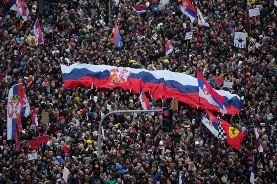 Protesters march during a major rally against populist President Aleksandar Vucic and his government, in downtown Belgrade, Serbia, Saturday, March 15, 2025. (AP Photo/Darko Vojinovic)