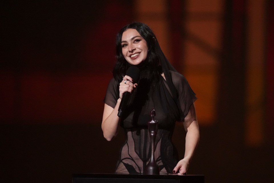 EDS NOTE: NUDITY - Charli xcx accepts the artist of the year award during the Brit Awards 2025 in London, Saturday, March 1, 2025. (Photo by Scott A Garfitt/Invision/AP)