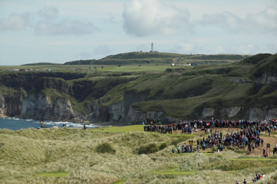 FILE - Golfers play from the 7th hole during the third round of the British Open Golf Championships at Royal Portrush in Northern Ireland, Saturday, July 20, 2019.(AP Photo/Jon Super, File)