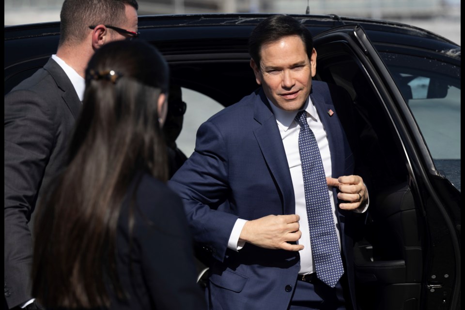 US Secretary of State Marco Rubio disembarks from his vehicle as he walks to board his airplane prior to departing Quebec City Jean Lesage International Airport in Quebec, Canada, Friday, March 14, 2025. (Saul Loeb, Pool Photo via AP)