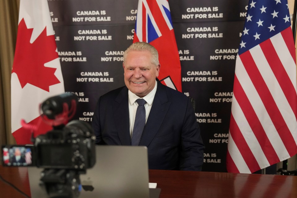 Ontario Premier Doug Ford prepares to speak to an American news outlet in his office at the Queens Park Legislature in Toronto on Monday, March 10, 2025. (Chris Young/The Canadian Press via AP)