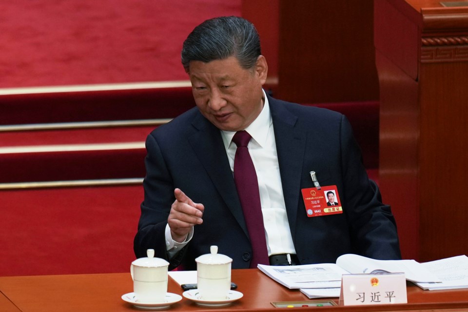 Chinese President Xi Jinping gestures during the opening session of the National People's Congress (NPC) at the Great Hall of the People in Beijing, China, Wednesday, March 5, 2025. (AP Photo/Ng Han Guan)