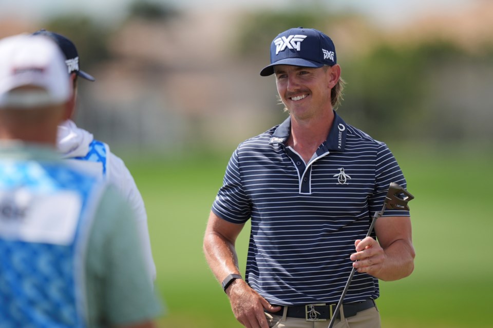 Jake Knapp smiles as he finishes with a 59 in the first round of the Cognizant Classic golf tournament, Thursday, Feb. 27, 2025, in Palm Beach Gardens, Fla. (AP Photo/Rebecca Blackwell)