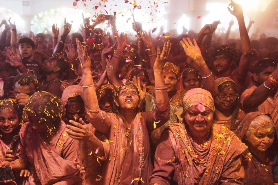 Holi festival Holi celebration at the Lord Jagannath temple in Ahmedabad, India, Friday, March 14, 2025. (AP Photo/Ajit Solanki)