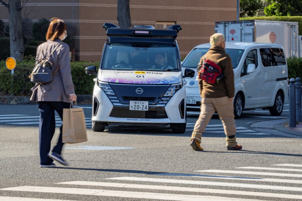 In this photo released by Nissan Motor Corp., its driverless vehicle, center, drives along a street in Yokohama, near Tokyo in February 2025. (Nissan Motor Corp. via AP)