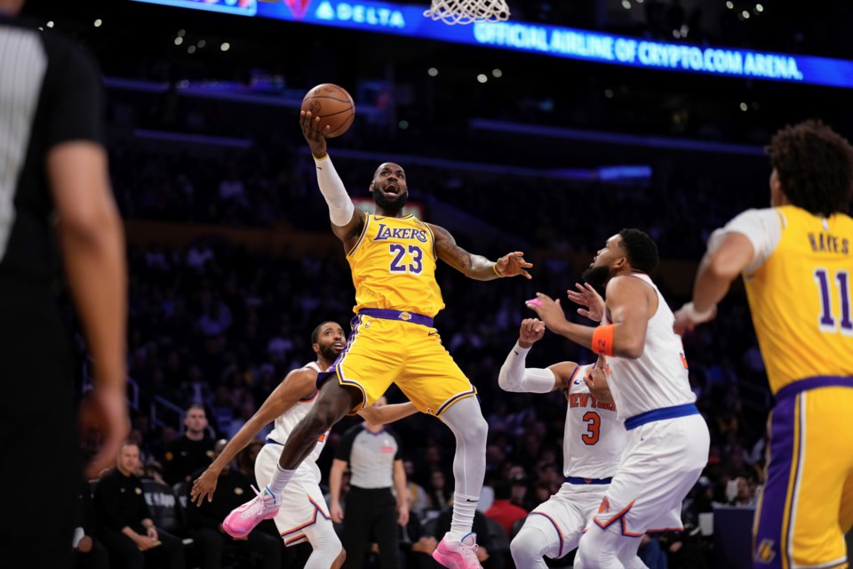 Los Angeles Lakers forward LeBron James (23) shoots as New York Knicks center Karl-Anthony Towns (32) and guard Josh Hart (3) defends while center Jaxson Hayes (11) watches during the first half of an NBA basketball game Thursday, March 6, 2025, in Los Angeles. (AP Photo/Mark J. Terrill)