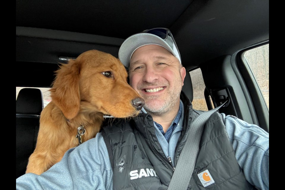 In this Feb. 2025 photo provided by Pam Palko, shown is Joe Palko after he was reunited with his six-month-old Golden retriever pup named Freddy, a week after the dog ran off from his home at the base of Sharp Mountain in Pottsville, Pa. (Joe Palko via AP)